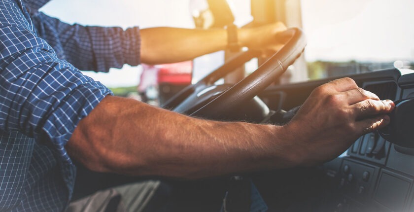 Truck driver keeps driving with hands