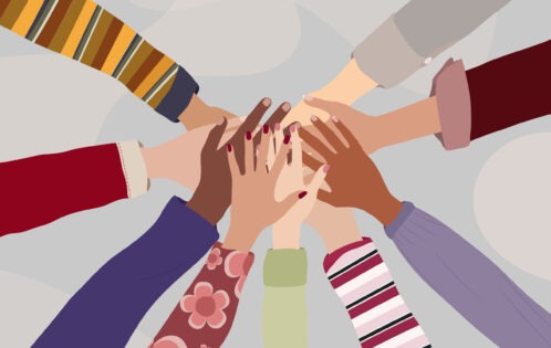 Illustration of multicultural hands reaching into a circle as a team