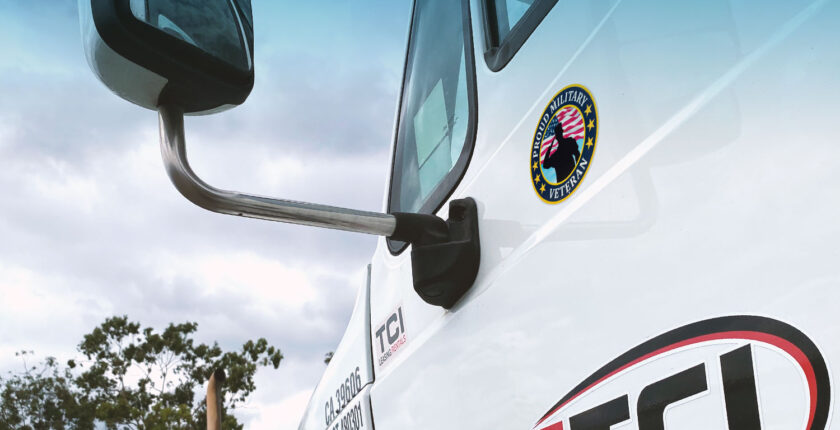 Close up of truck side door with "Proud to be a Veteran" sticker