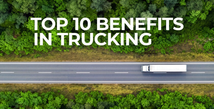 Overhead angle of white tractor trailer driving down straight road in the forest