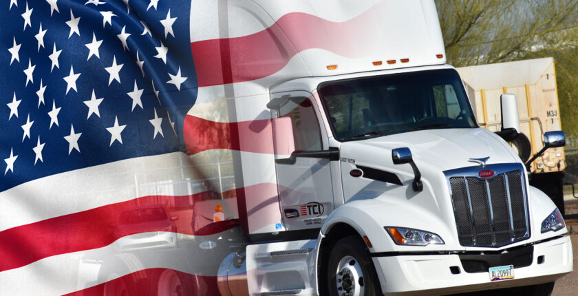 American flag superimposed over white Peterbilt truck