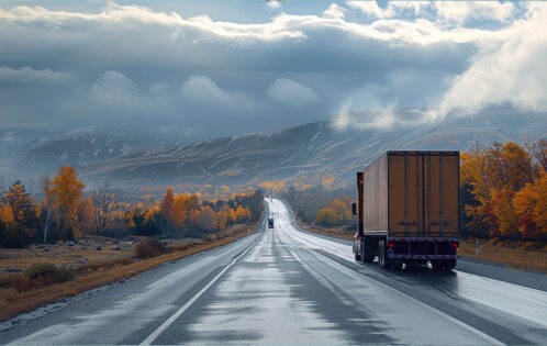 Truck driving down scenic highway