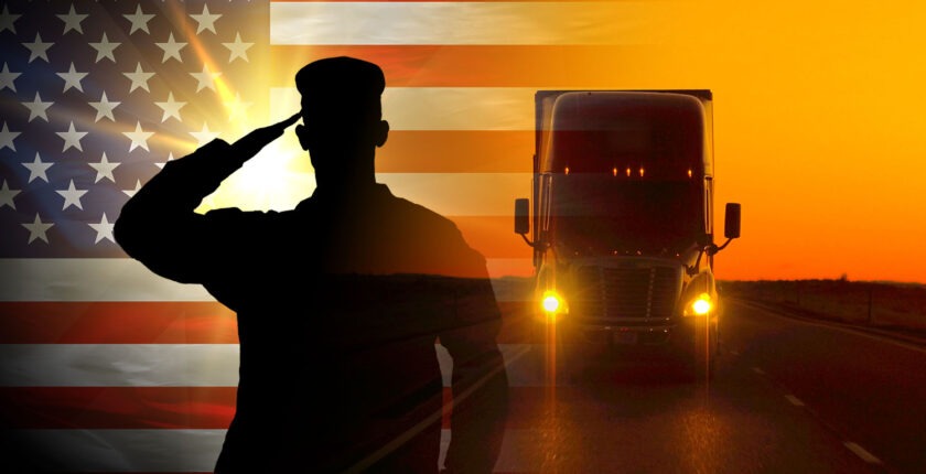 Proud saluting male army soldier on american flag background superimposed over semi at sunrise