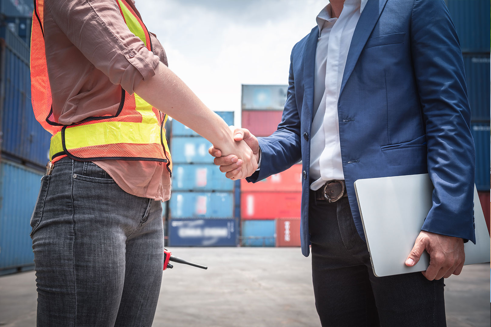 Man & Woman shaking hands at loading dock