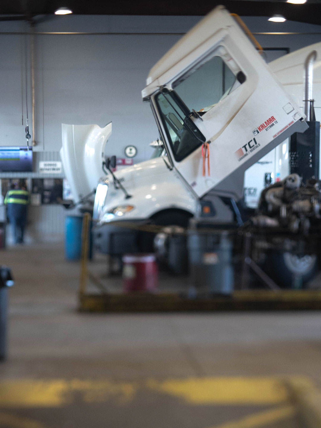 Yard tractors in garage with cab in the open position